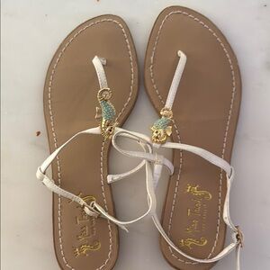 Unlisted White and Tan Sandals with T-Strap Design with sea horse.